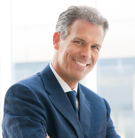 Man smiling wearing a suit