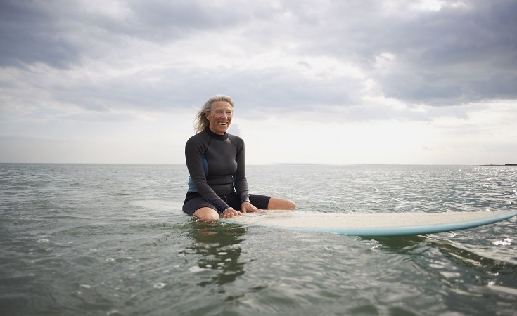 Lady surfing in the ocean