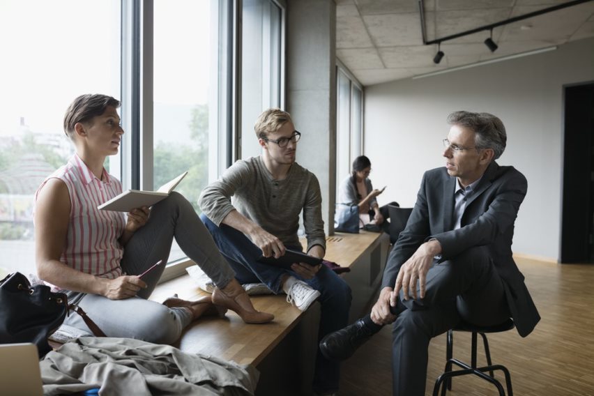 group sitting in a room talking